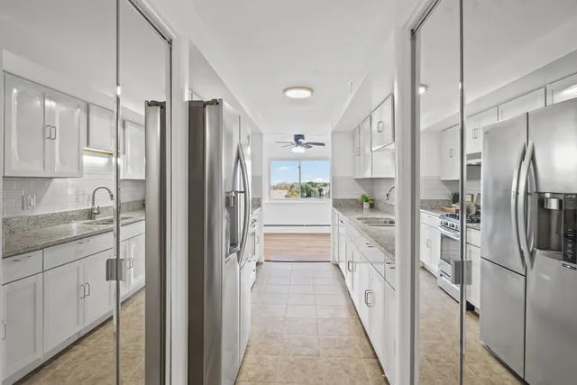 a kitchen that has a sink and a stove