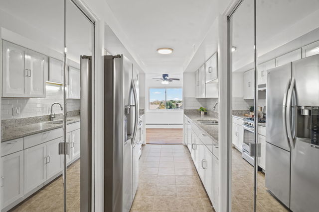 7540 North Ridge Boulevard, Unit 5D Chicago, IL 60645 - Photo 4 of 15 a kitchen with stainless steel appliances a refrigerator and a sink