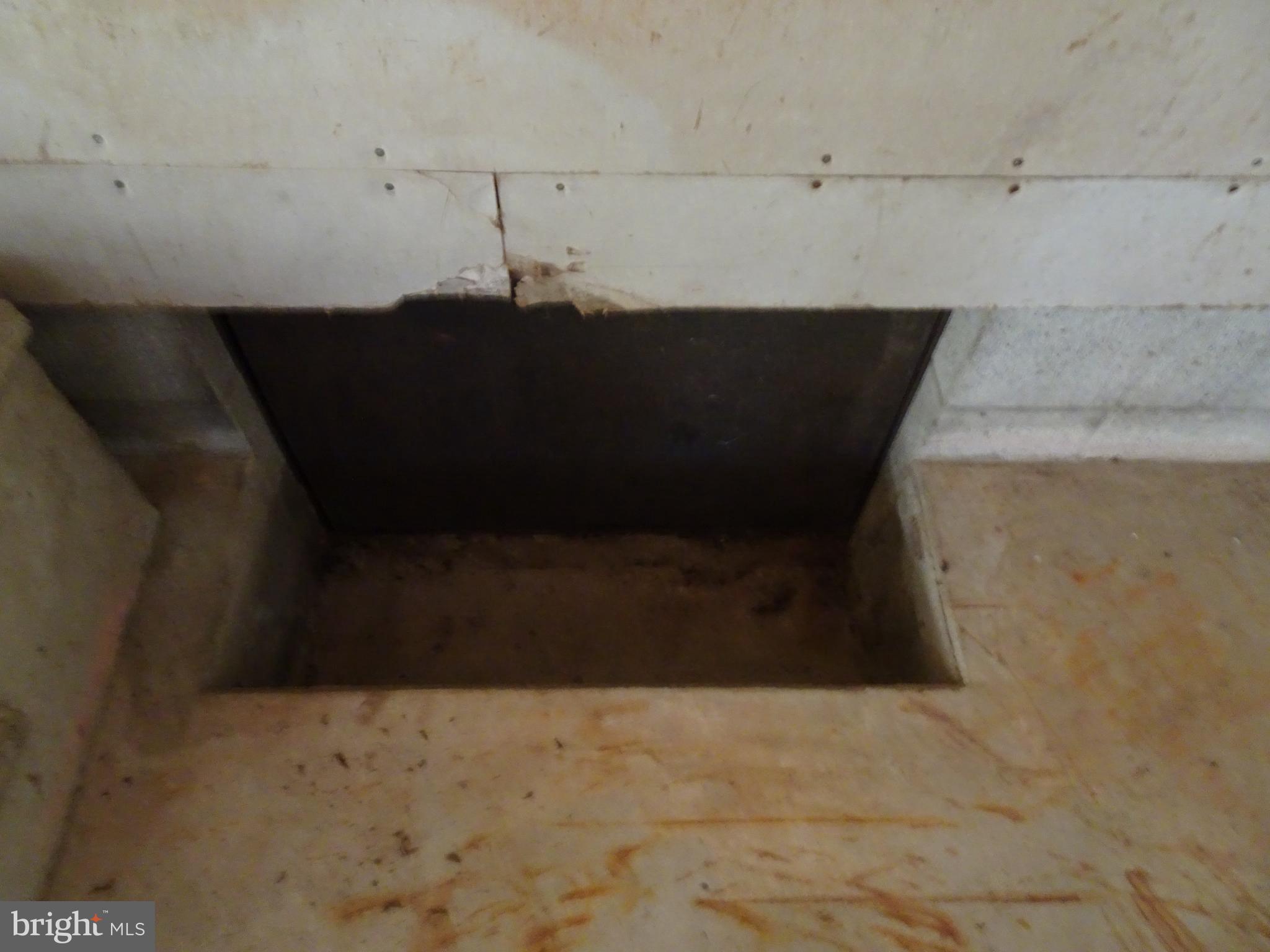 12672 Oakland Road Ridgely, MD 21660 - Photo 29 of 38 Crawl space opening located in garage