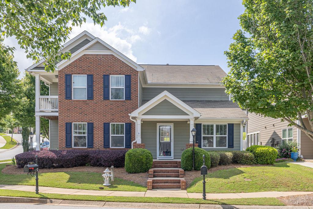 a front view of a house with a yard