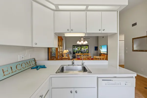 a view of a kitchen with appliances and cabinets