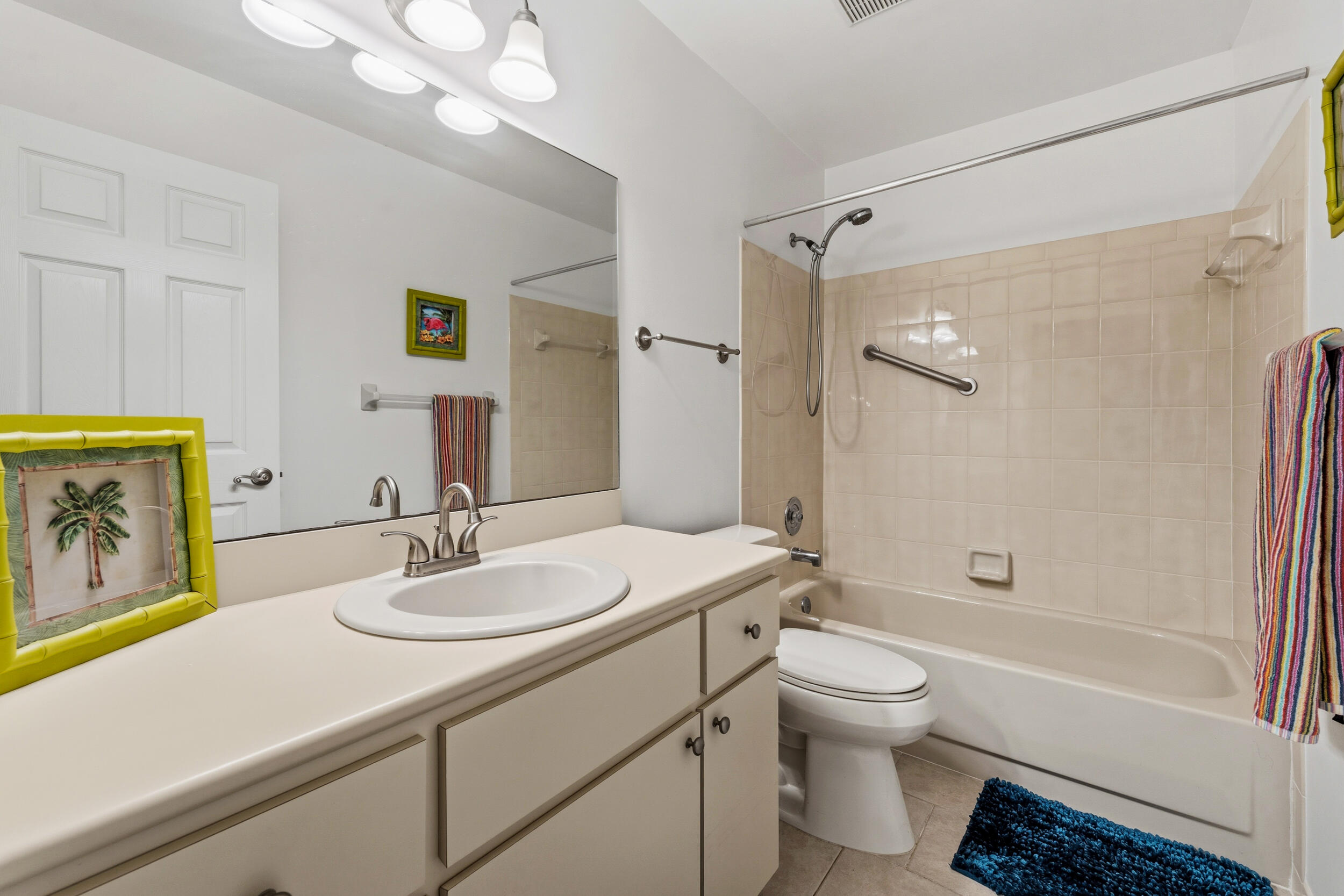 7873 Southeast Sugar Sand Circle Hobe Sound, FL 33455 - Photo 22 of 35 a bathroom with a sink a toilet and shower