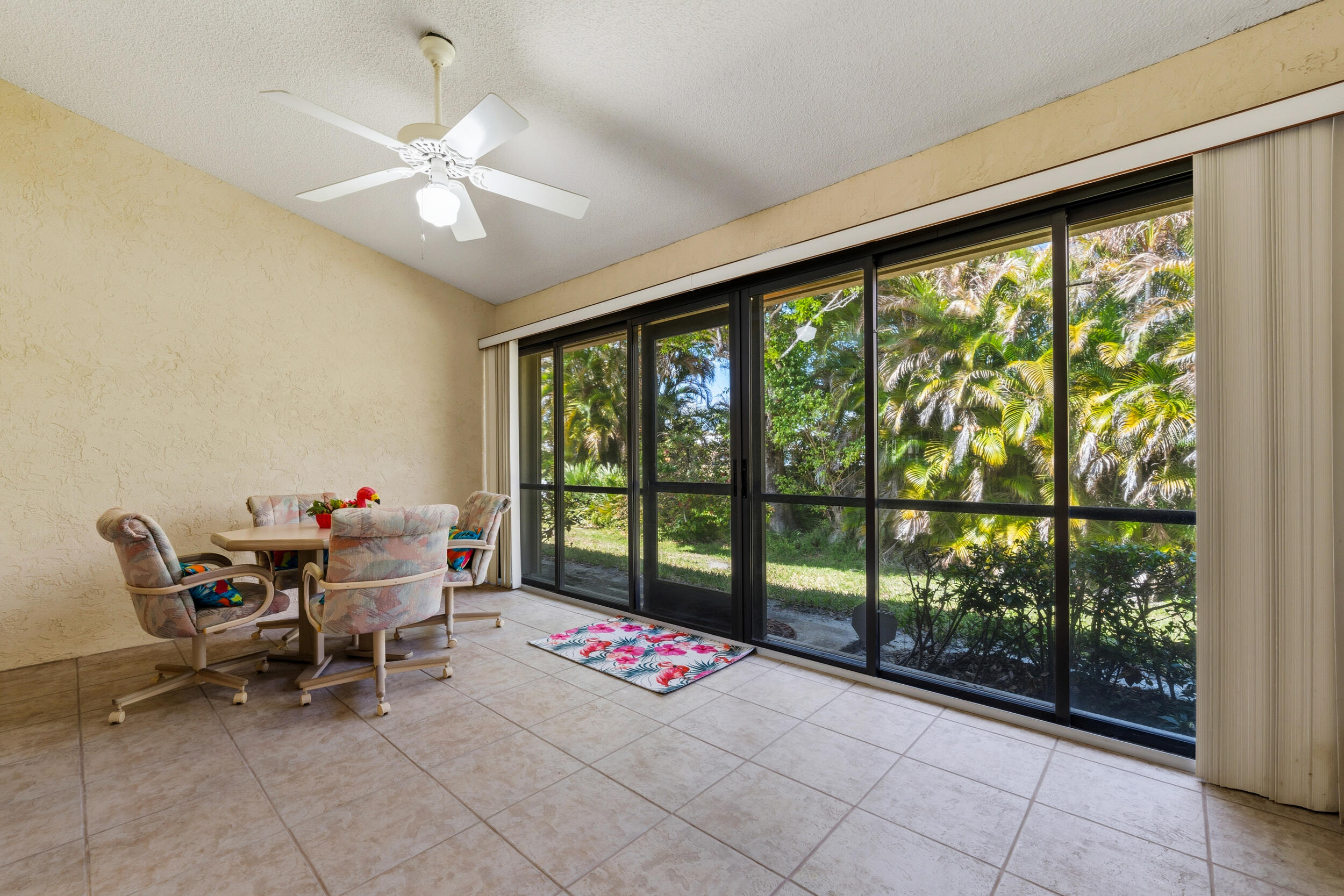 7873 Southeast Sugar Sand Circle Hobe Sound, FL 33455 - Photo 24 of 35 a living room with furniture and a large window