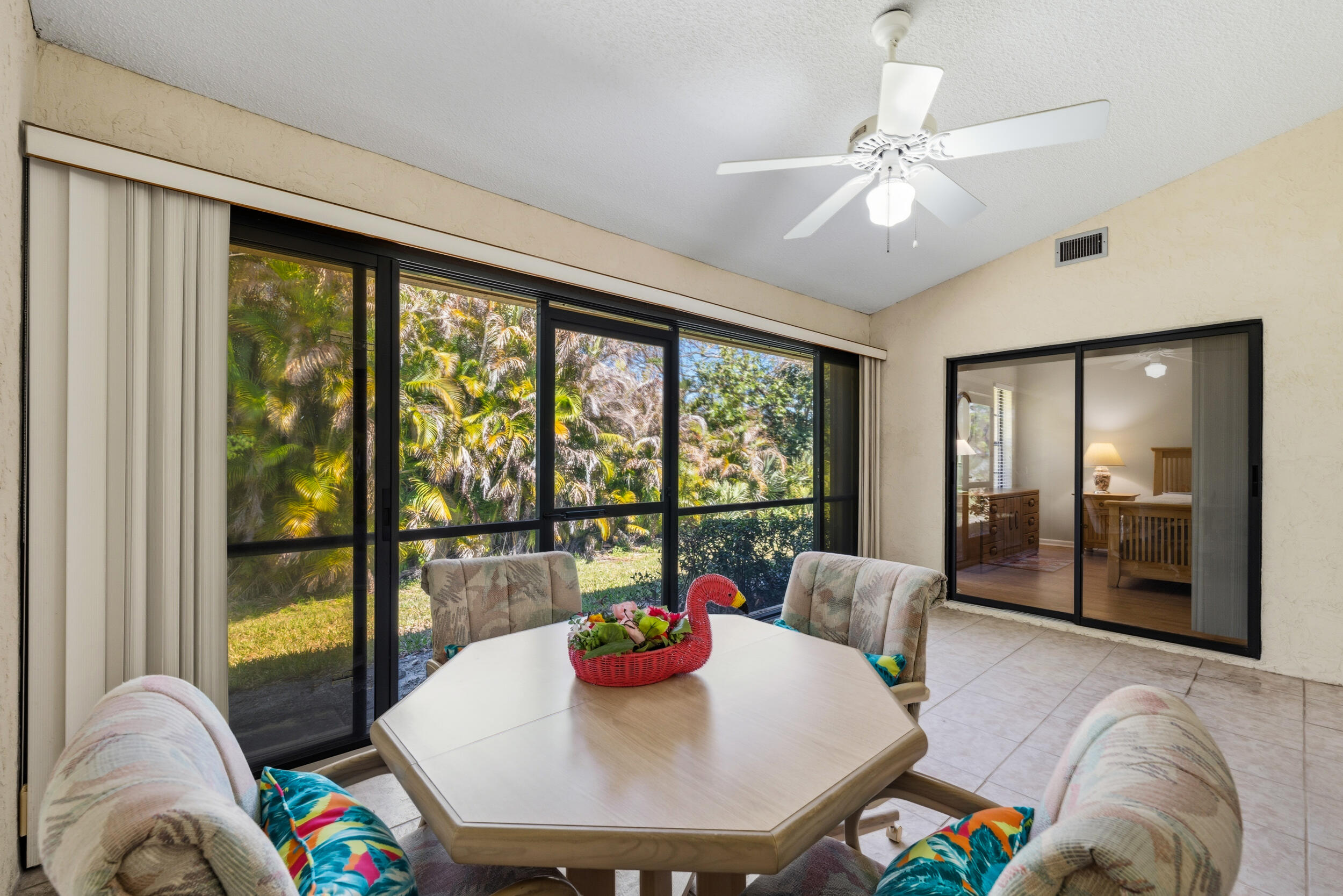 7873 Southeast Sugar Sand Circle Hobe Sound, FL 33455 - Photo 25 of 35 a living room with furniture and a large window
