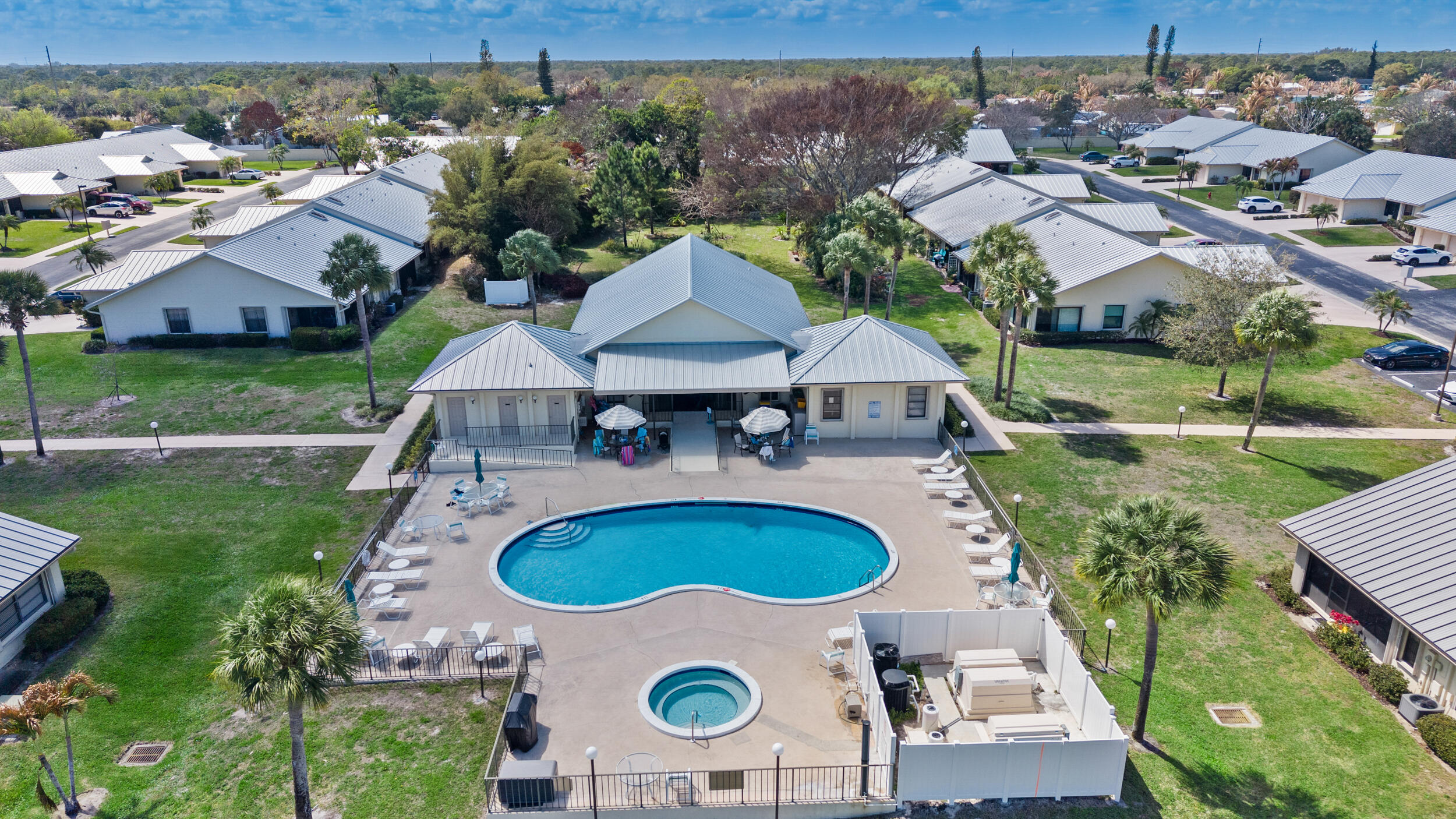 7873 Southeast Sugar Sand Circle Hobe Sound, FL 33455 - Photo 27 of 35 an aerial view of a house with swimming pool patio and outdoor seating