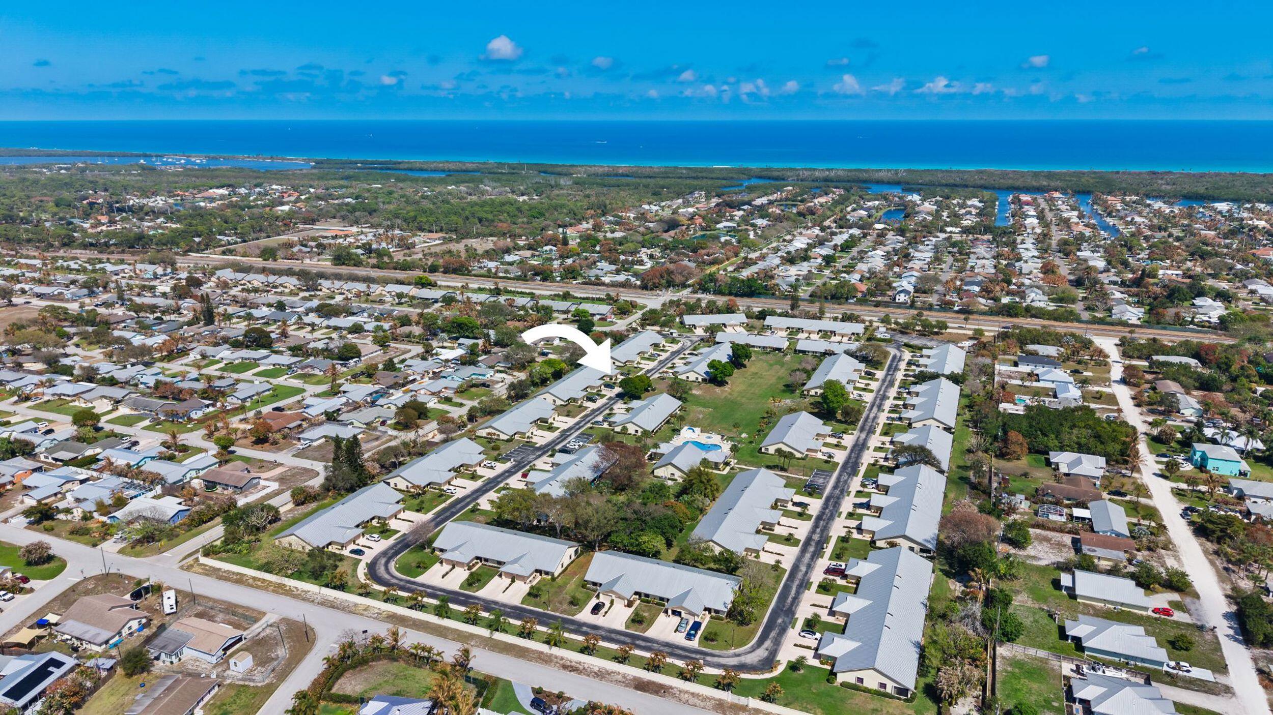 7873 Southeast Sugar Sand Circle Hobe Sound, FL 33455 - Photo 4 of 35 an aerial view of a city