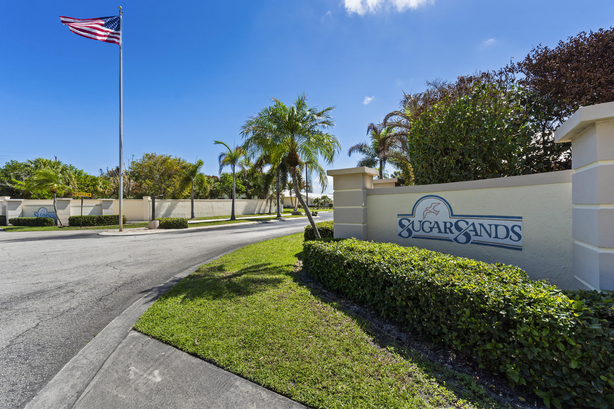 7873 Southeast Sugar Sand Circle Hobe Sound, FL 33455 - Photo 5 of 35 a view of a street with a sign board