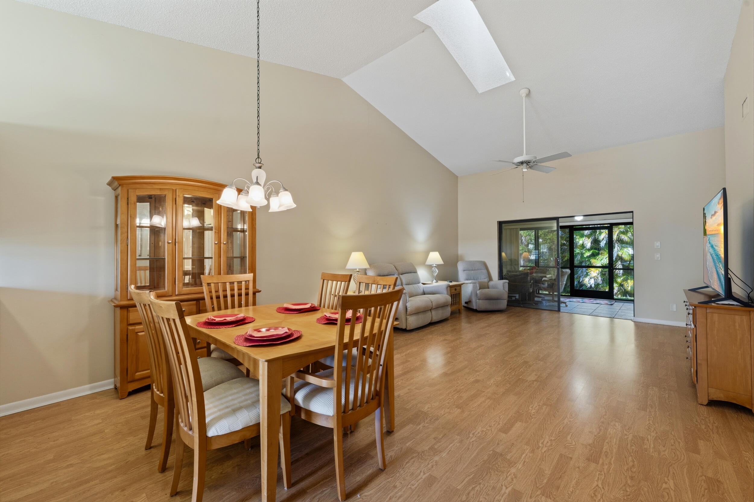 7873 Southeast Sugar Sand Circle Hobe Sound, FL 33455 - Photo 9 of 35 a view of a dining room with furniture window and wooden floor