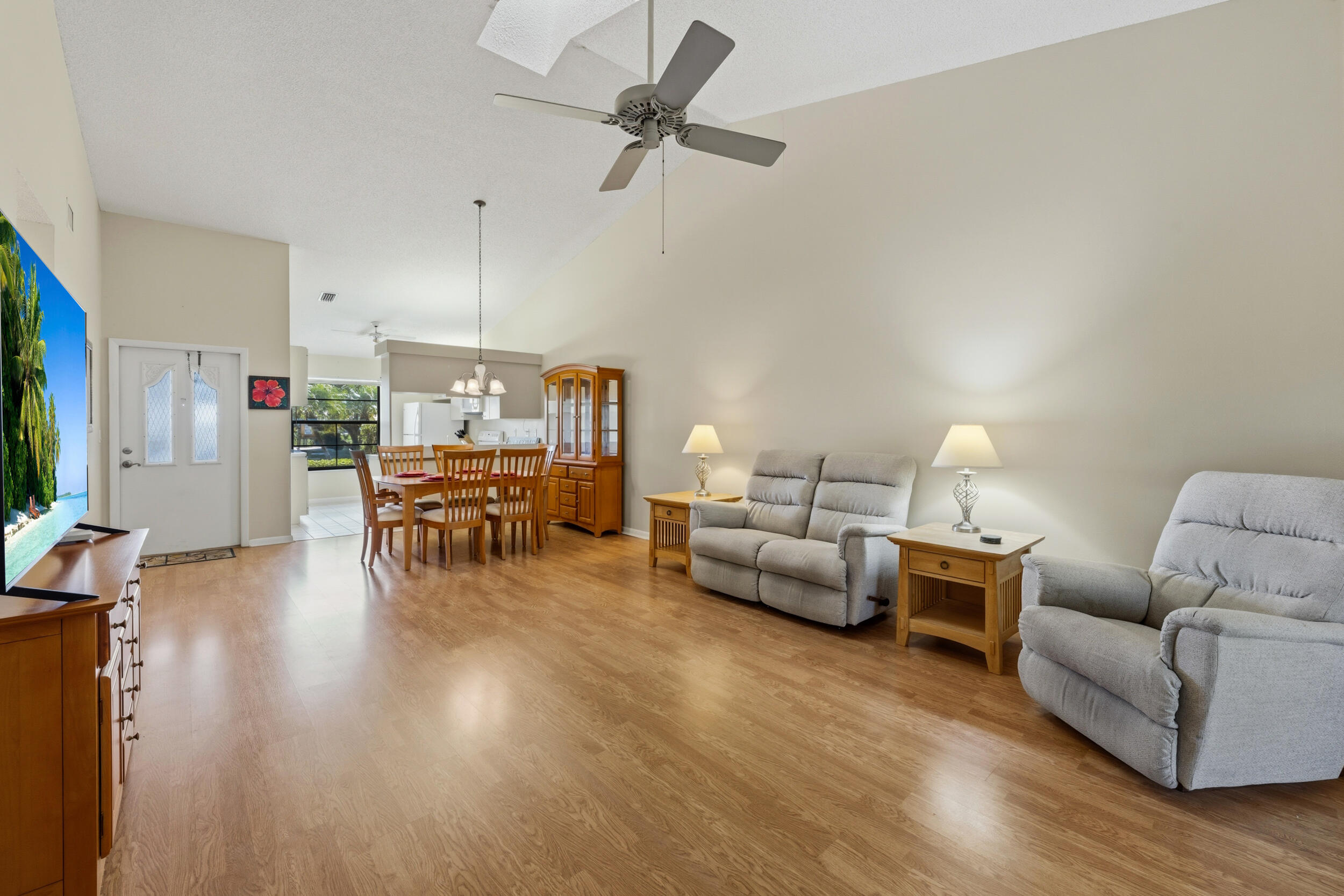 7873 Southeast Sugar Sand Circle Hobe Sound, FL 33455 - Photo 10 of 35 a living room with furniture and wooden floor