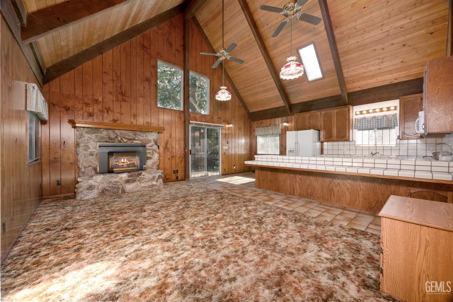 Undisclosed Address Wofford Heights, CA 93285 - Photo 15 of 26 a large room with a fireplace in it