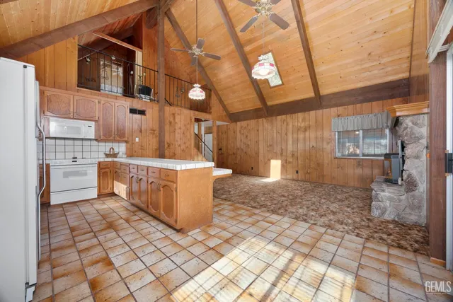 a kitchen with stainless steel appliances a sink and cabinets