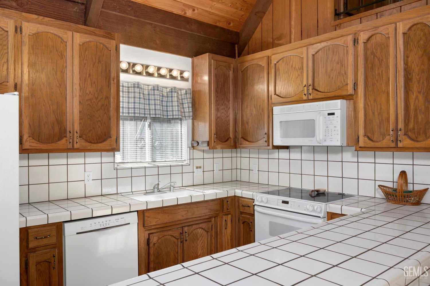 Undisclosed Address Wofford Heights, CA 93285 - Photo 18 of 26 a kitchen with stainless steel appliances a sink and cabinets