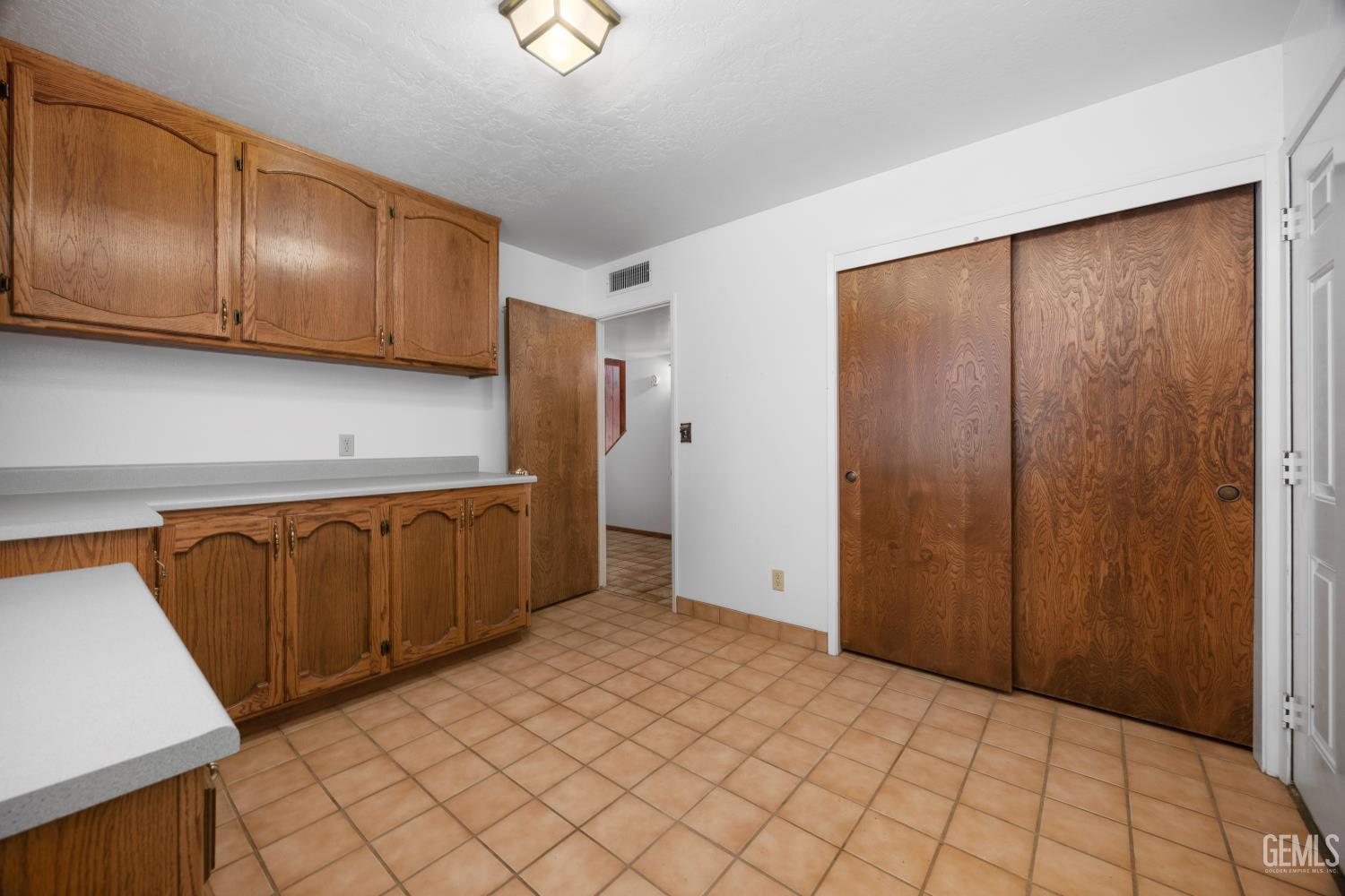 Undisclosed Address Wofford Heights, CA 93285 - Photo 21 of 26 a view of a kitchen with wooden cabinets