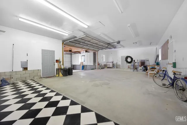 a view of a livingroom with furniture and a garage