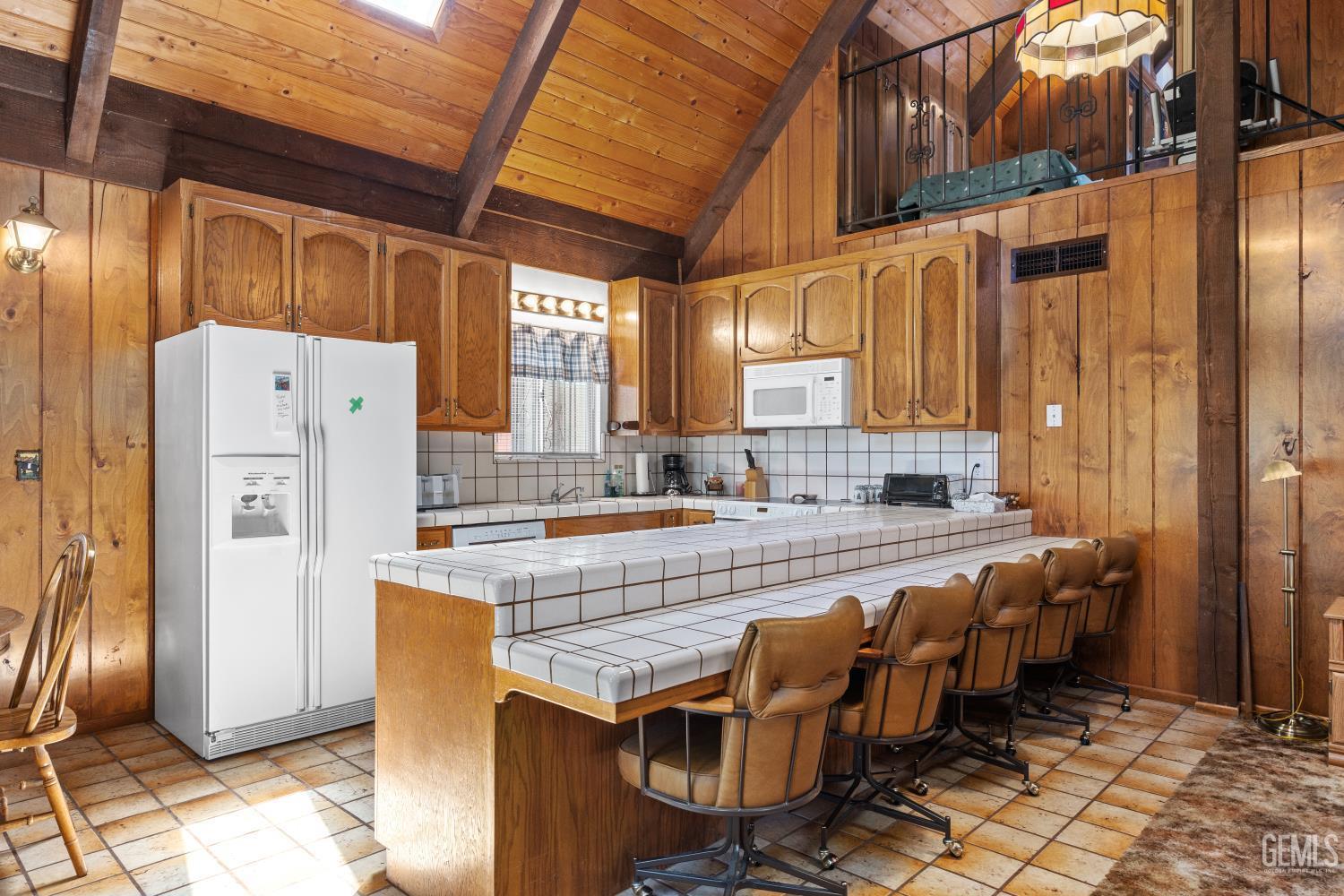 Undisclosed Address Wofford Heights, CA 93285 - Photo 10 of 26 a large kitchen with lots of counter space and windows