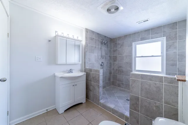 a bathroom with a sink a bathtub and a shower