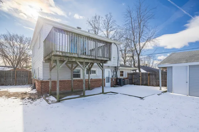 a view of a backyard of the house