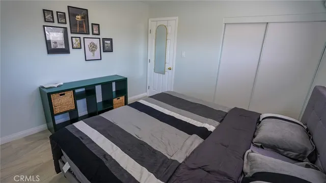 a bedroom with a bed and furniture