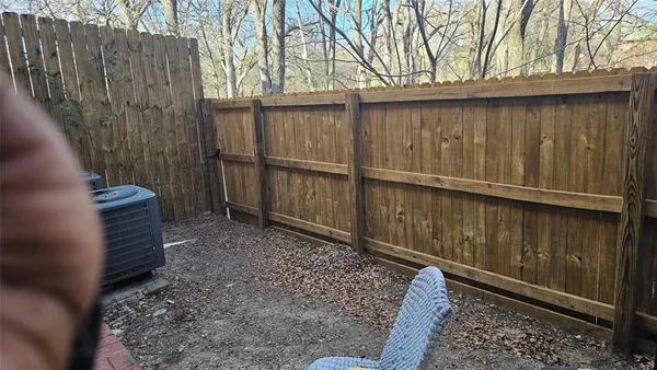 a view of a pathway with a yard