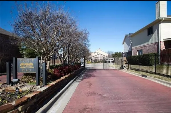 a front view of a house with trees