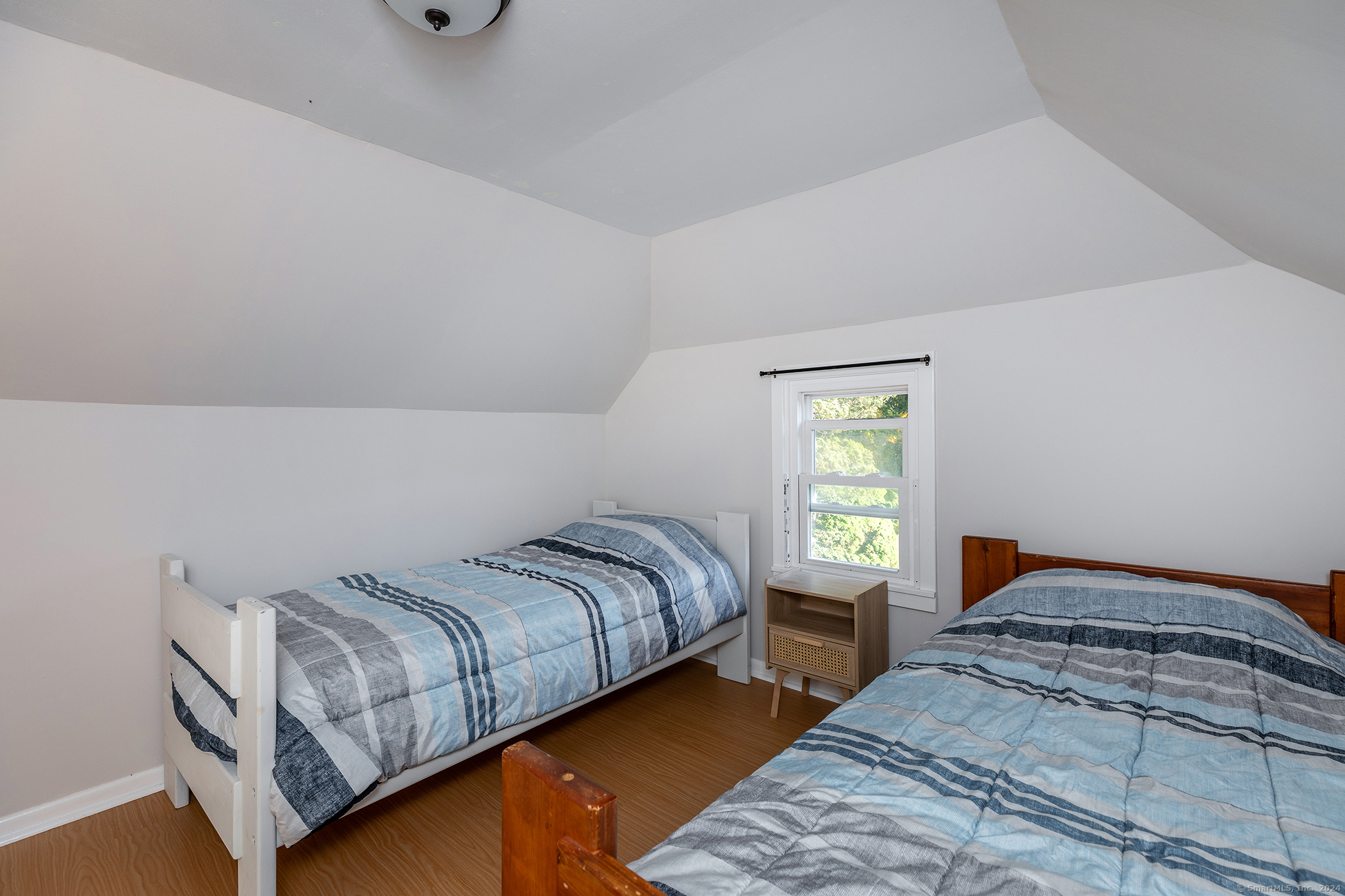 5 Windmill Road New Fairfield, CT 06812 - Photo 19 of 37 a bedroom with a bed and window
