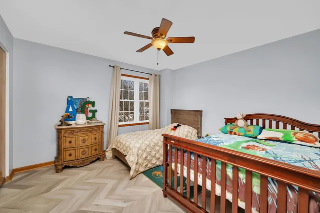 a bathroom with painting on the wall and a shower curtain