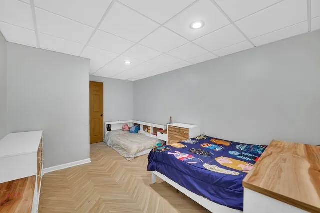 a view of backyard with swimming pool and furniture