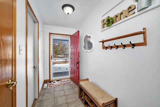 a bedroom with furniture and a flat screen tv