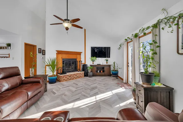 a living room with furniture and a fireplace