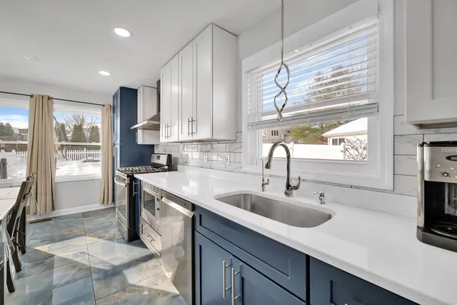 a kitchen with a stove and a refrigerator