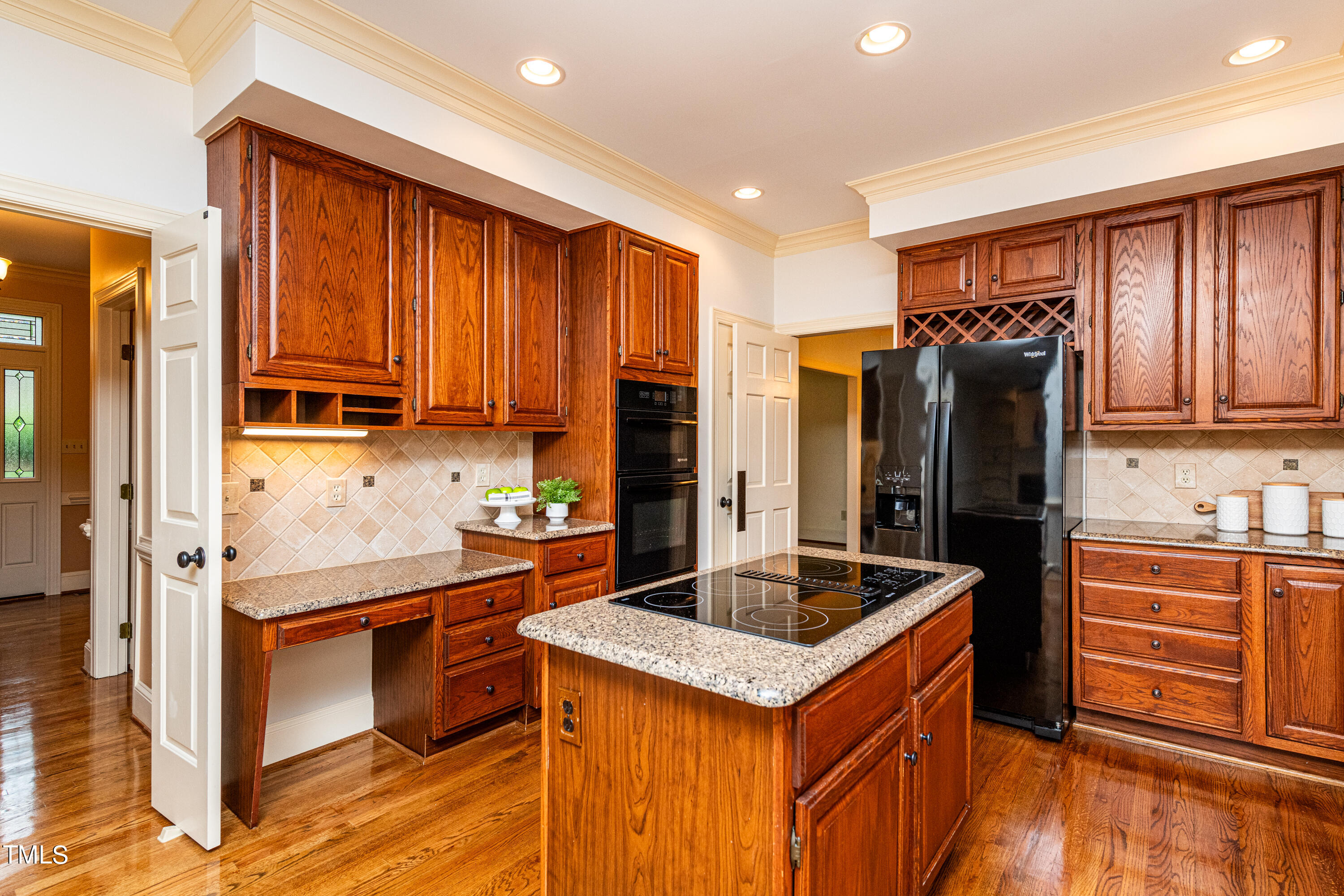 104 Kettlebridge Drive Cary, NC 27511 - Photo 11 of 48 a kitchen with stainless steel appliances granite countertop a refrigerator and a stove