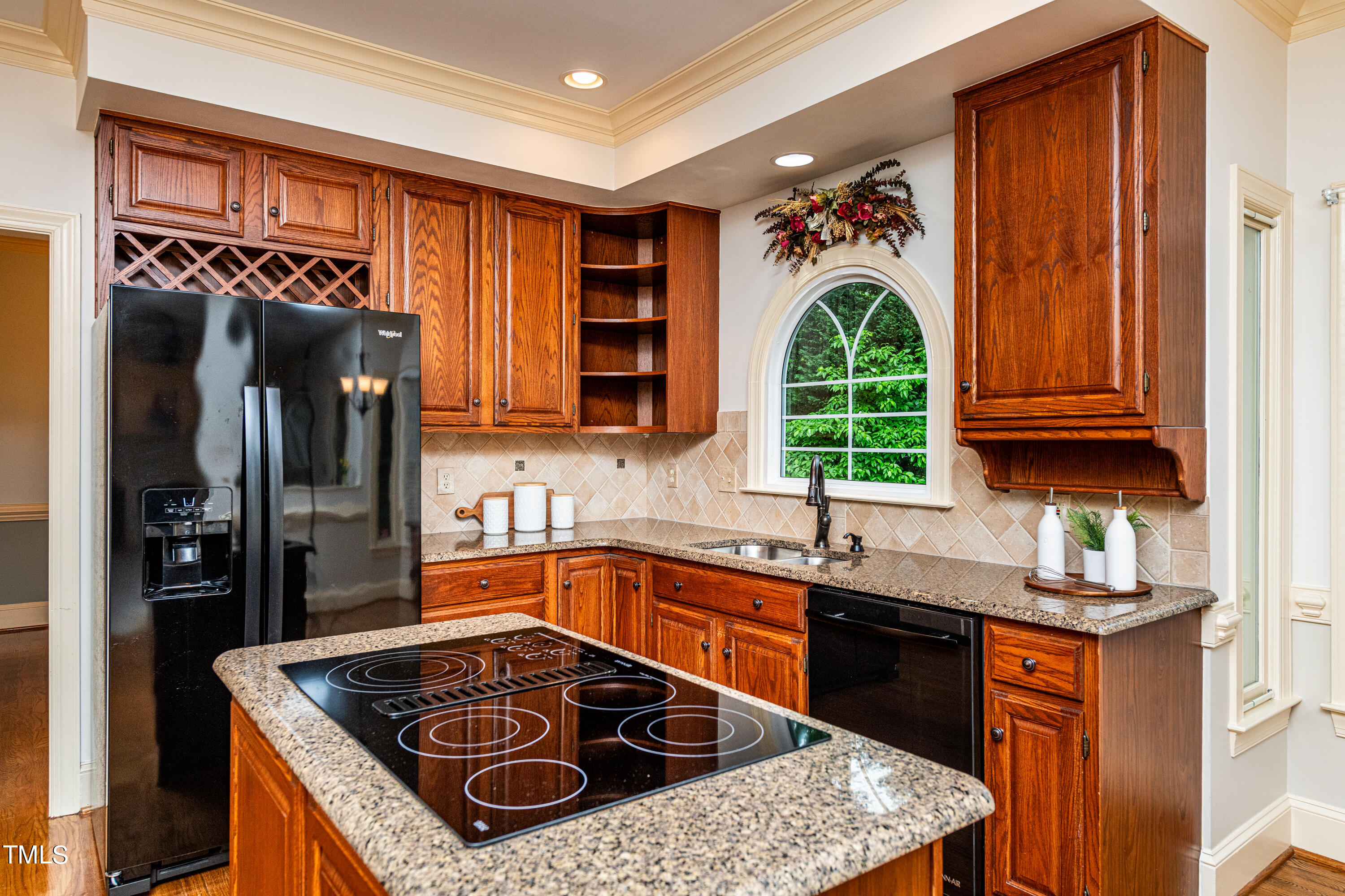 104 Kettlebridge Drive Cary, NC 27511 - Photo 12 of 48 a kitchen with stainless steel appliances granite countertop a sink stove and refrigerator
