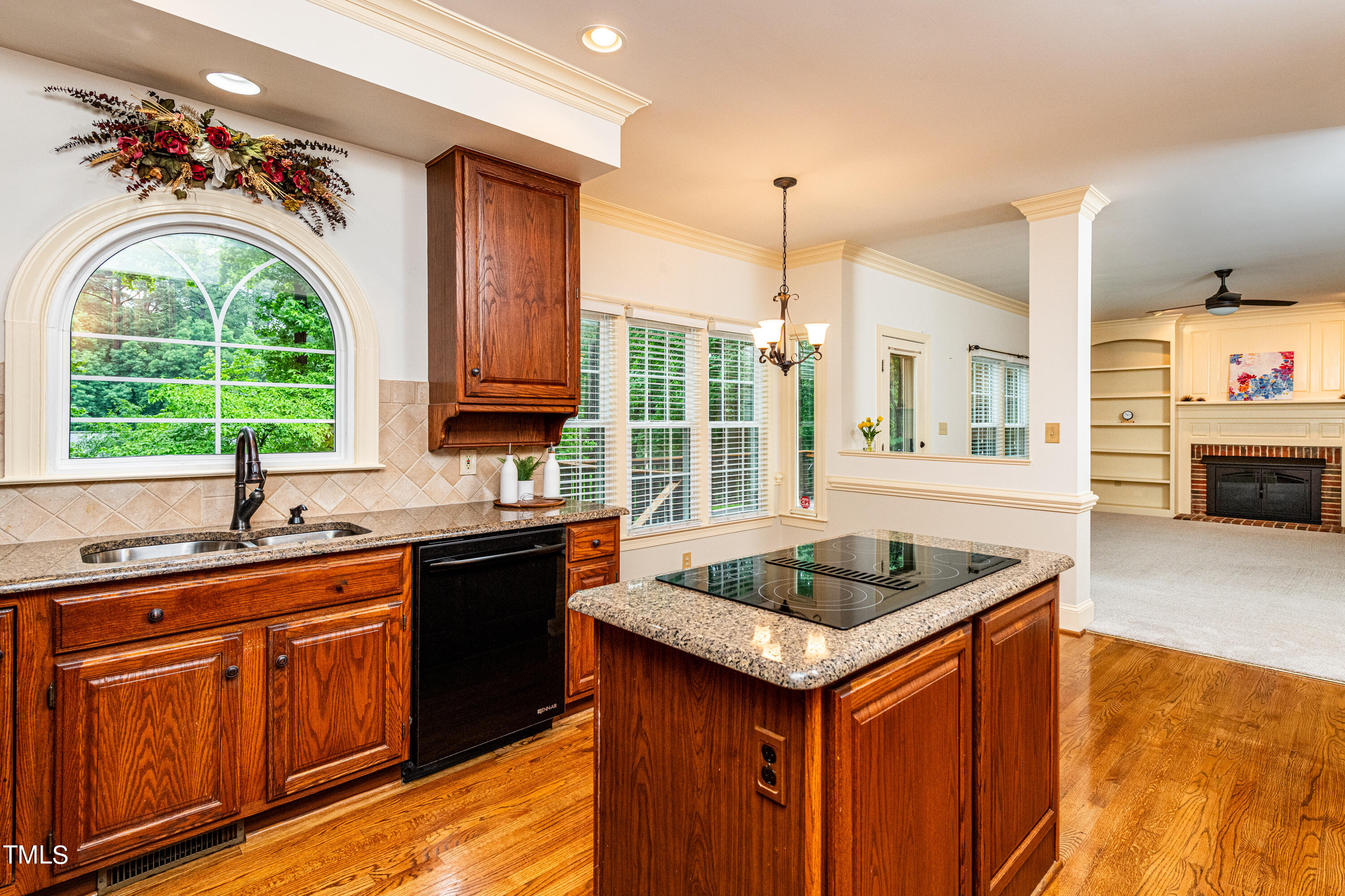 104 Kettlebridge Drive Cary, NC 27511 - Photo 13 of 48 a kitchen that has a sink a oven a stove a dining table and chairs