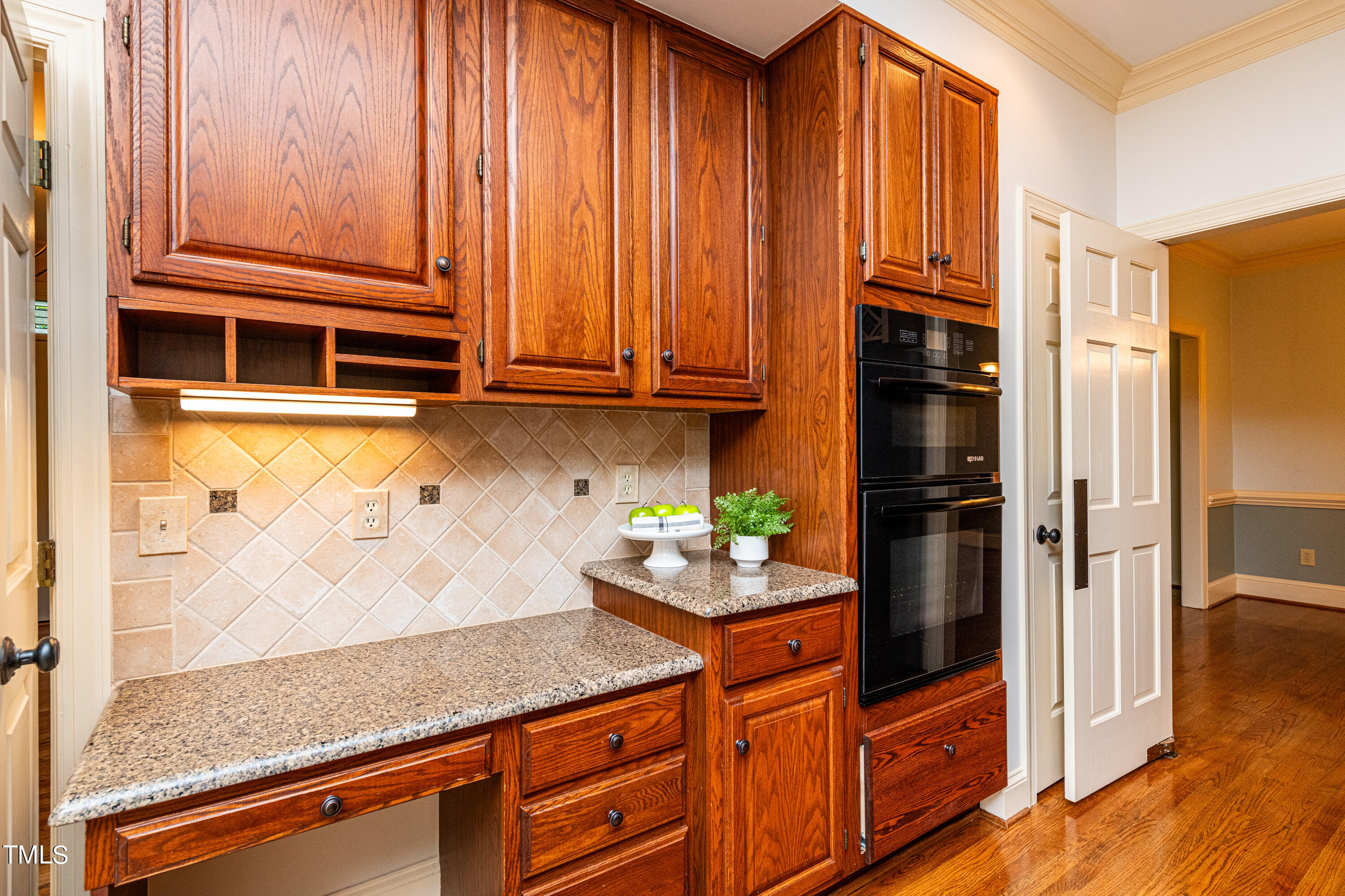 104 Kettlebridge Drive Cary, NC 27511 - Photo 14 of 48 a kitchen with stainless steel appliances granite countertop a refrigerator and a stove top oven