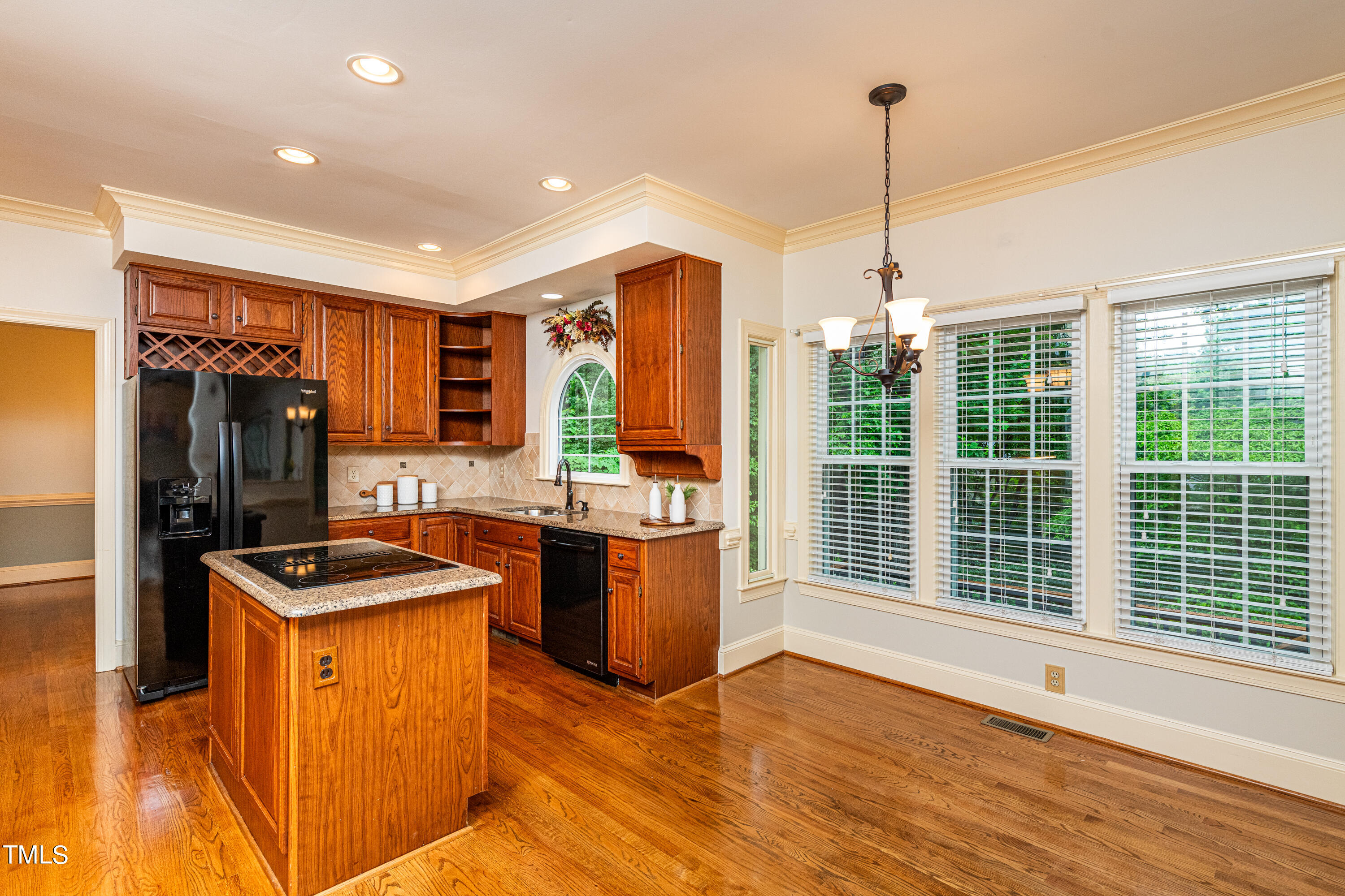 104 Kettlebridge Drive Cary, NC 27511 - Photo 17 of 48 a kitchen with stainless steel appliances granite countertop sink stove and refrigerator