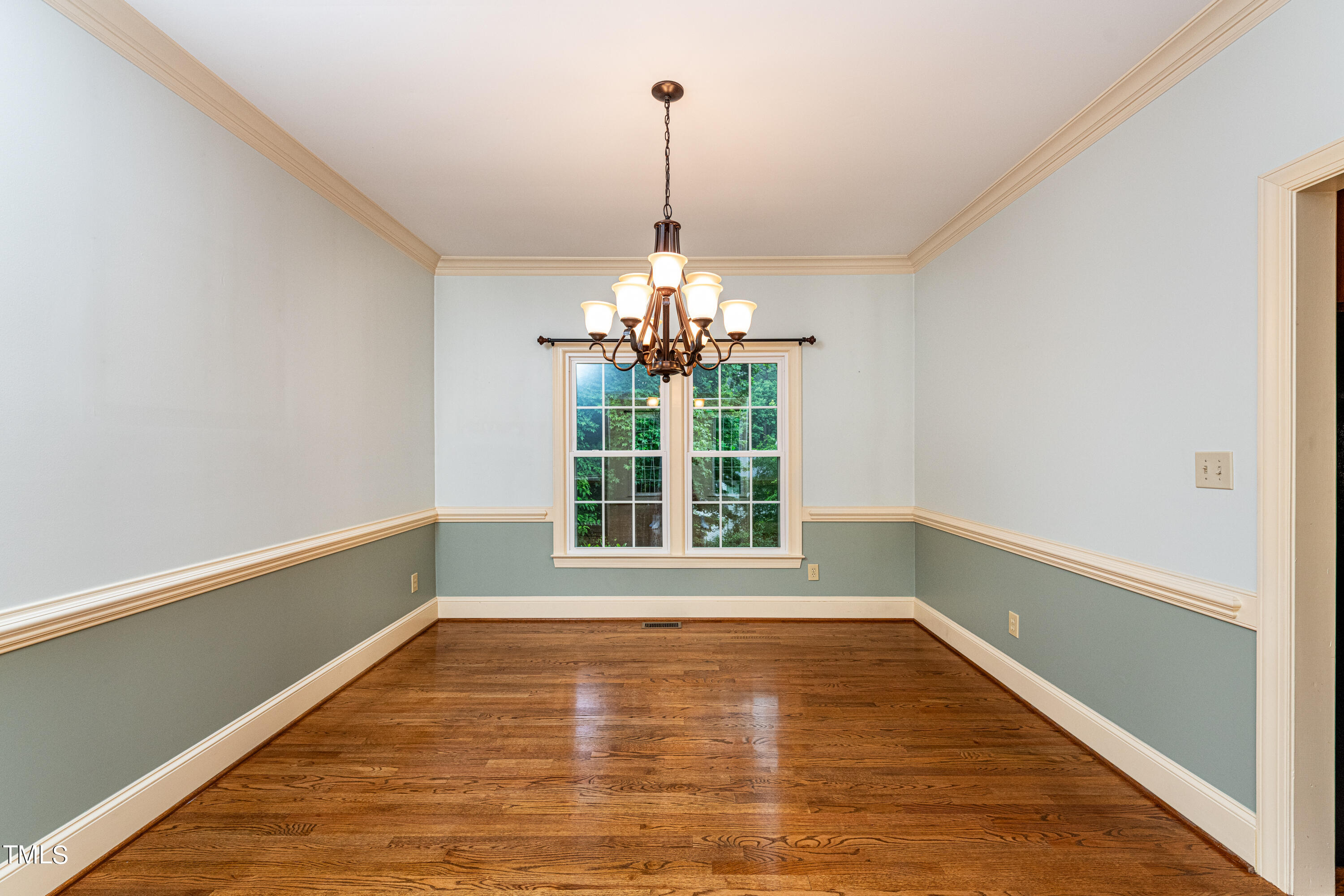 104 Kettlebridge Drive Cary, NC 27511 - Photo 19 of 48 a view of a room with window wooden floor and a ceiling fan
