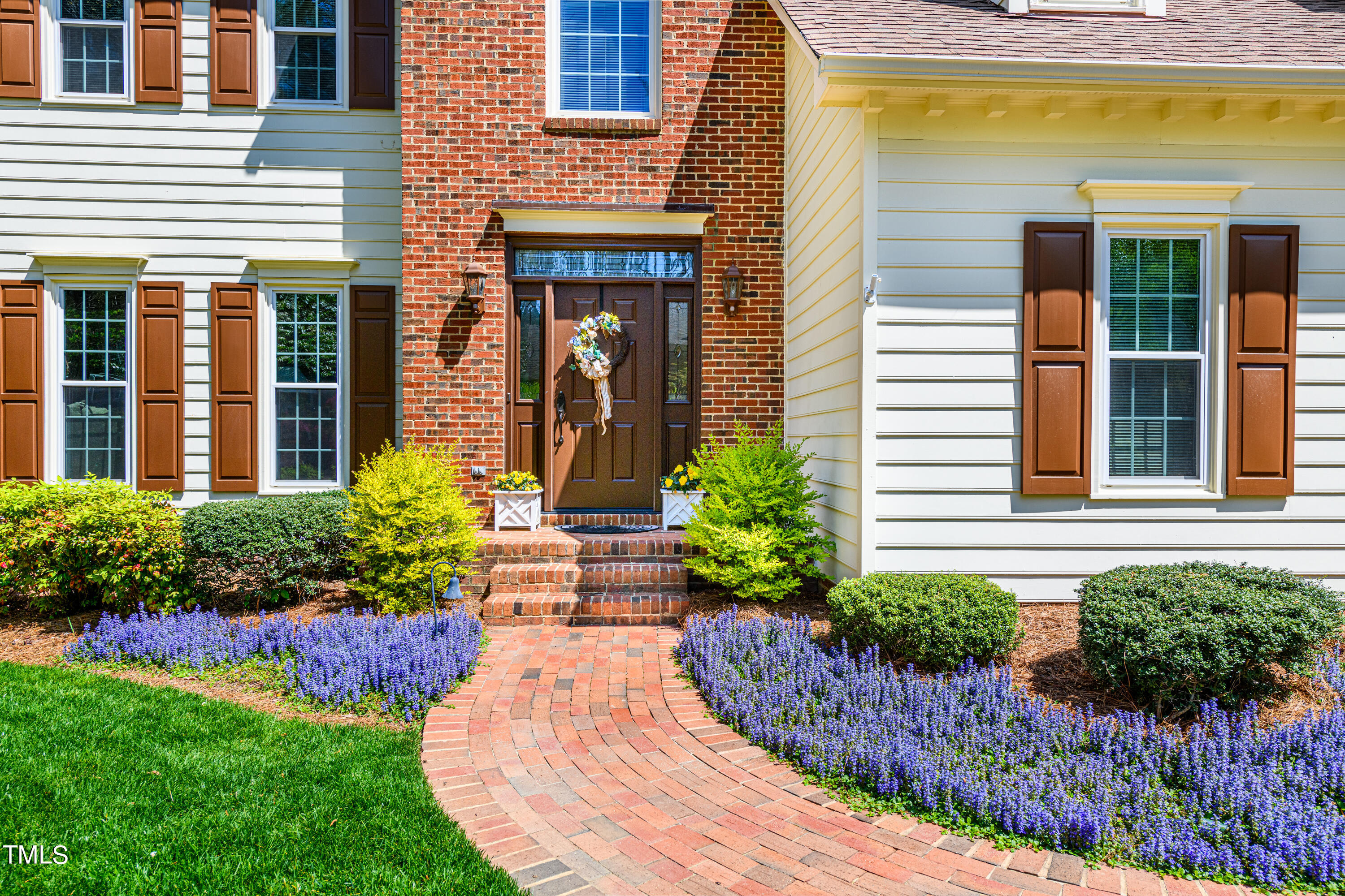 104 Kettlebridge Drive Cary, NC 27511 - Photo 2 of 48 front view of a house with a yard