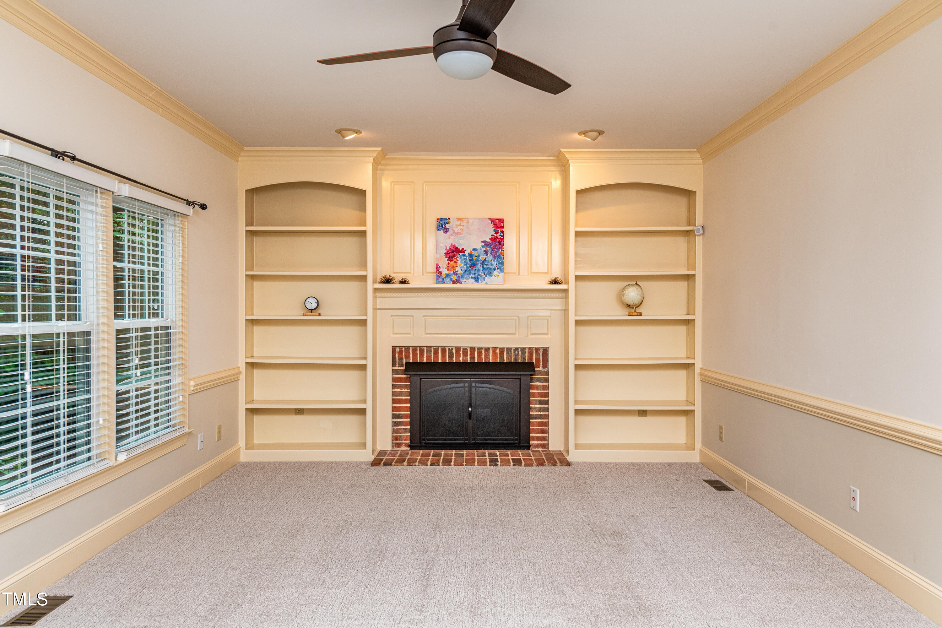 104 Kettlebridge Drive Cary, NC 27511 - Photo 23 of 48 a living room with furniture and a fireplace
