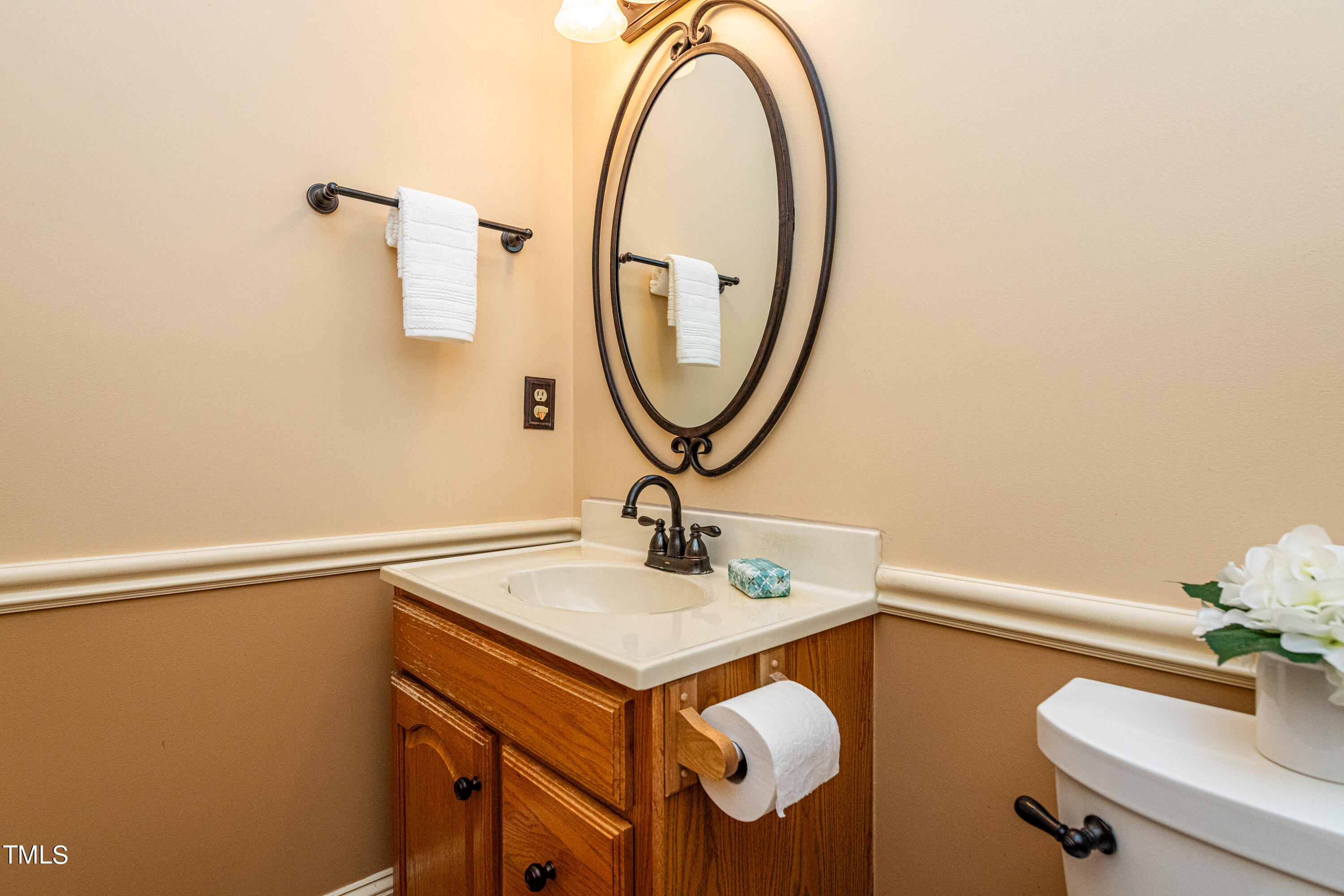 104 Kettlebridge Drive Cary, NC 27511 - Photo 25 of 48 a bathroom with a sink and a mirror