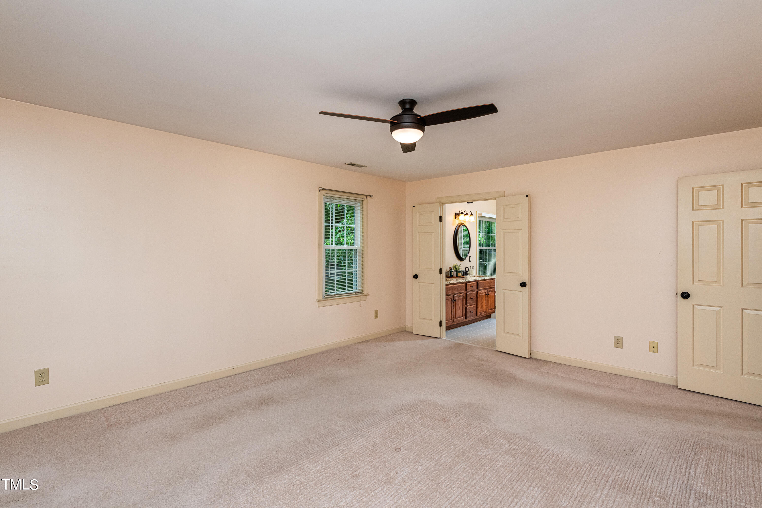 104 Kettlebridge Drive Cary, NC 27511 - Photo 27 of 48 an empty room with windows and fan
