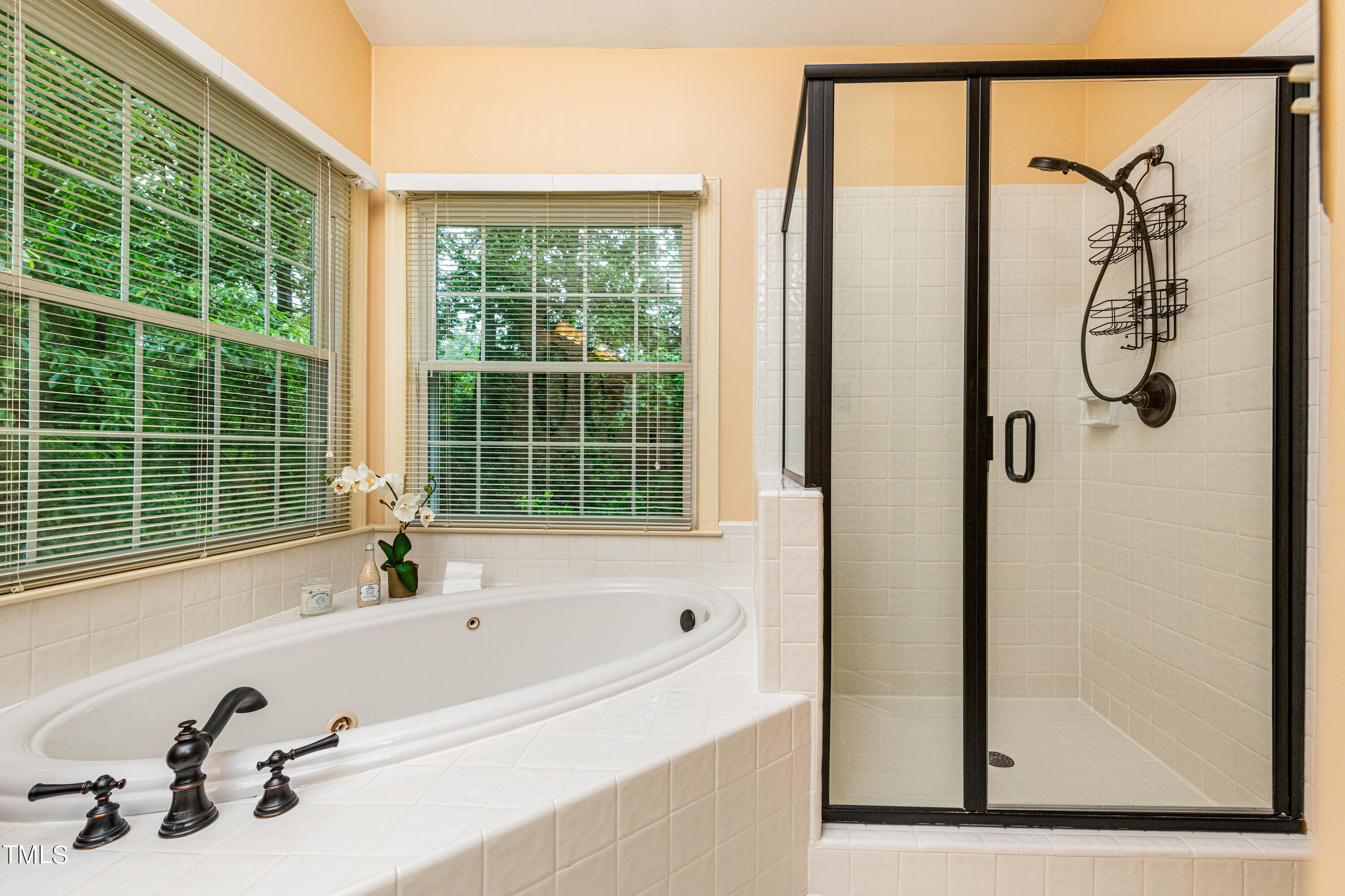 104 Kettlebridge Drive Cary, NC 27511 - Photo 30 of 48 a bathroom with a bathtub and a shower