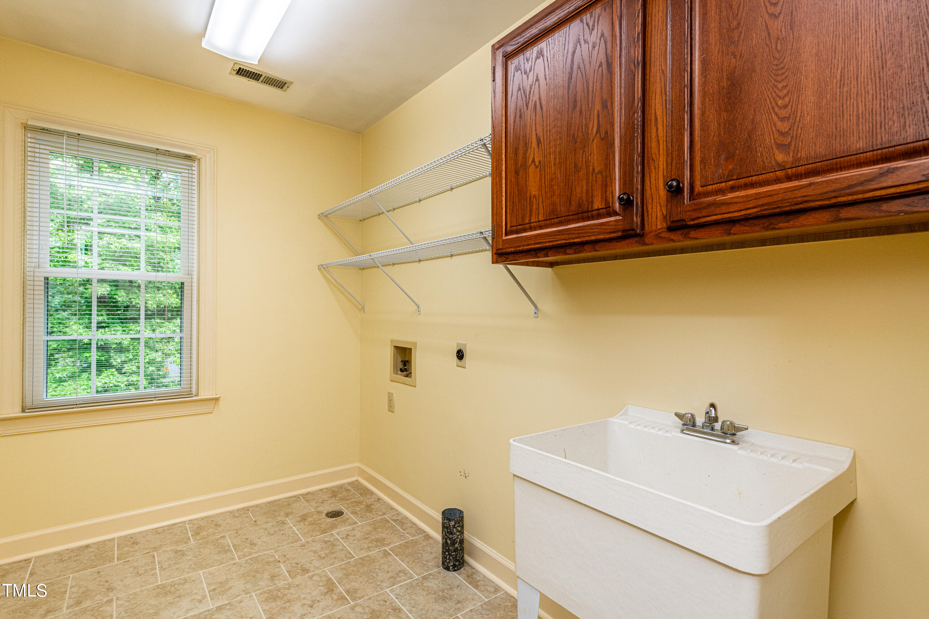 104 Kettlebridge Drive Cary, NC 27511 - Photo 39 of 48 a utility room with dryer and washer