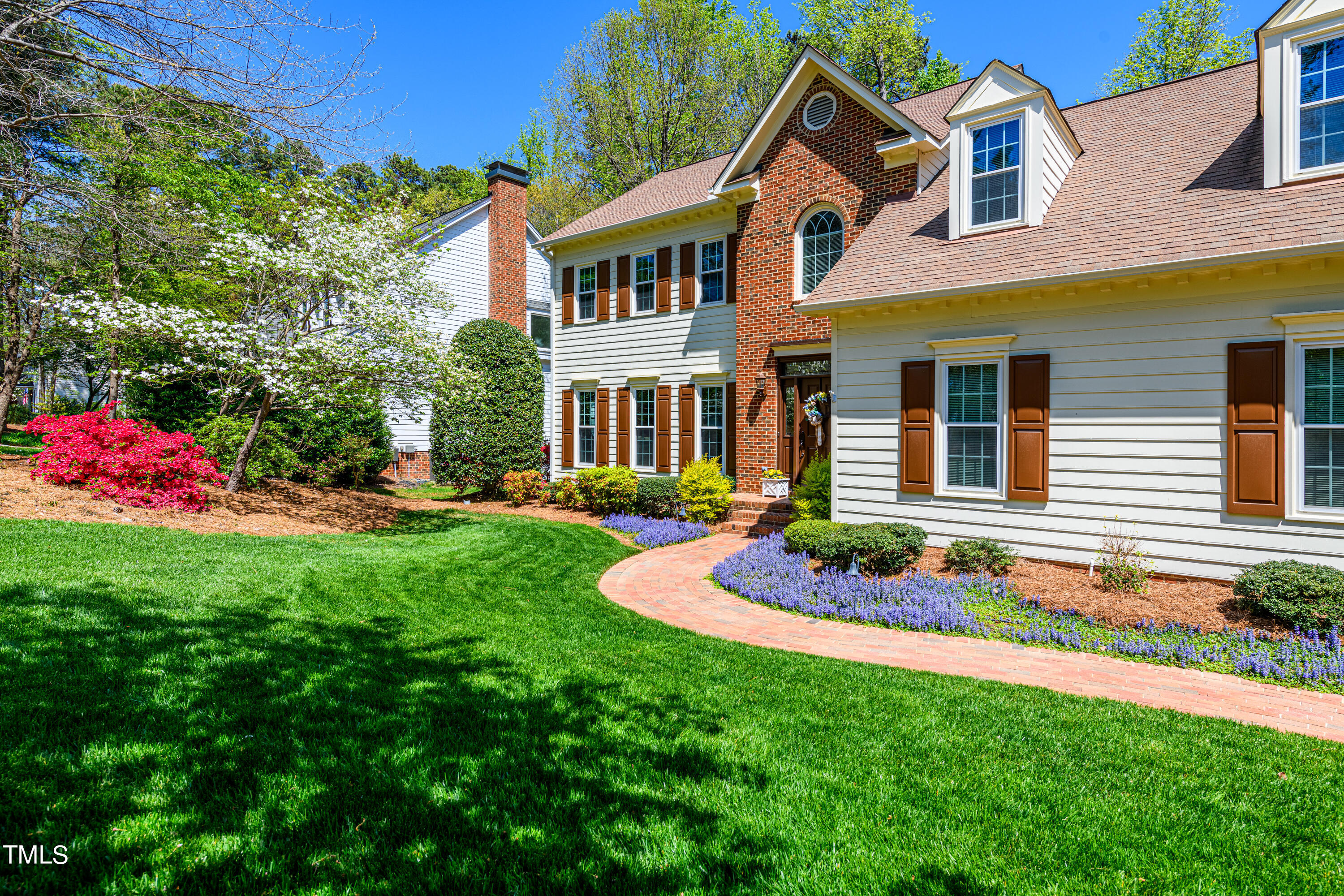 104 Kettlebridge Drive Cary, NC 27511 - Photo 4 of 48 a front view of a house with a yard