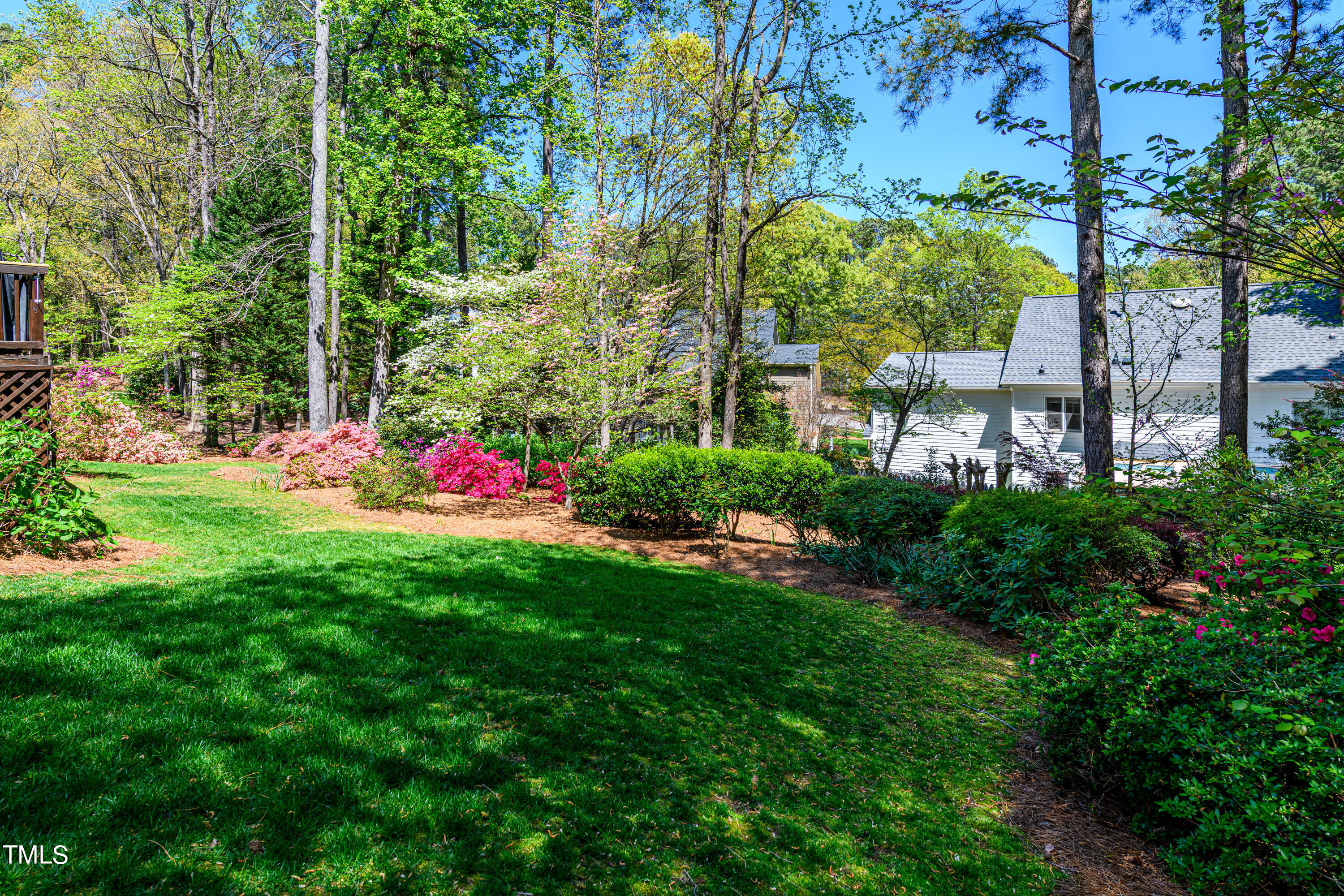 104 Kettlebridge Drive Cary, NC 27511 - Photo 41 of 48 a view of a flower garden with a small yard