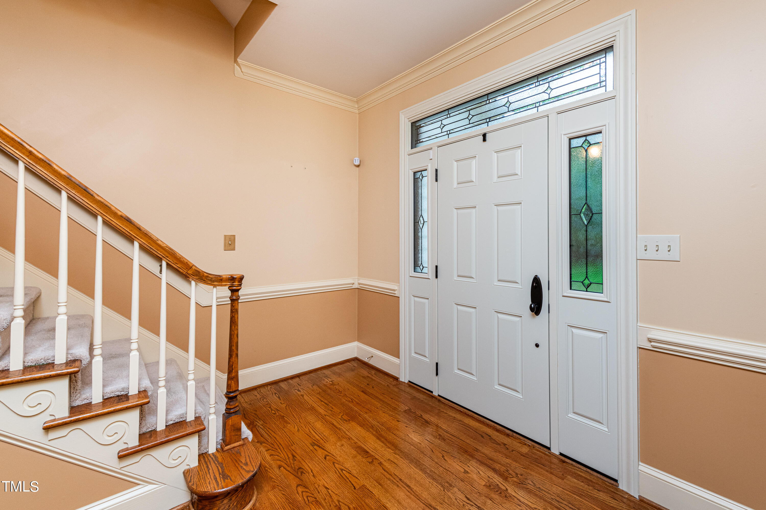 104 Kettlebridge Drive Cary, NC 27511 - Photo 7 of 48 a view of a hallway with wooden floor and entryway