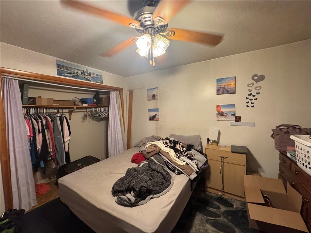 215 Maple Street Kittanning, PA 16201 - Photo 22 of 39 a bedroom with a bed and a chandelier