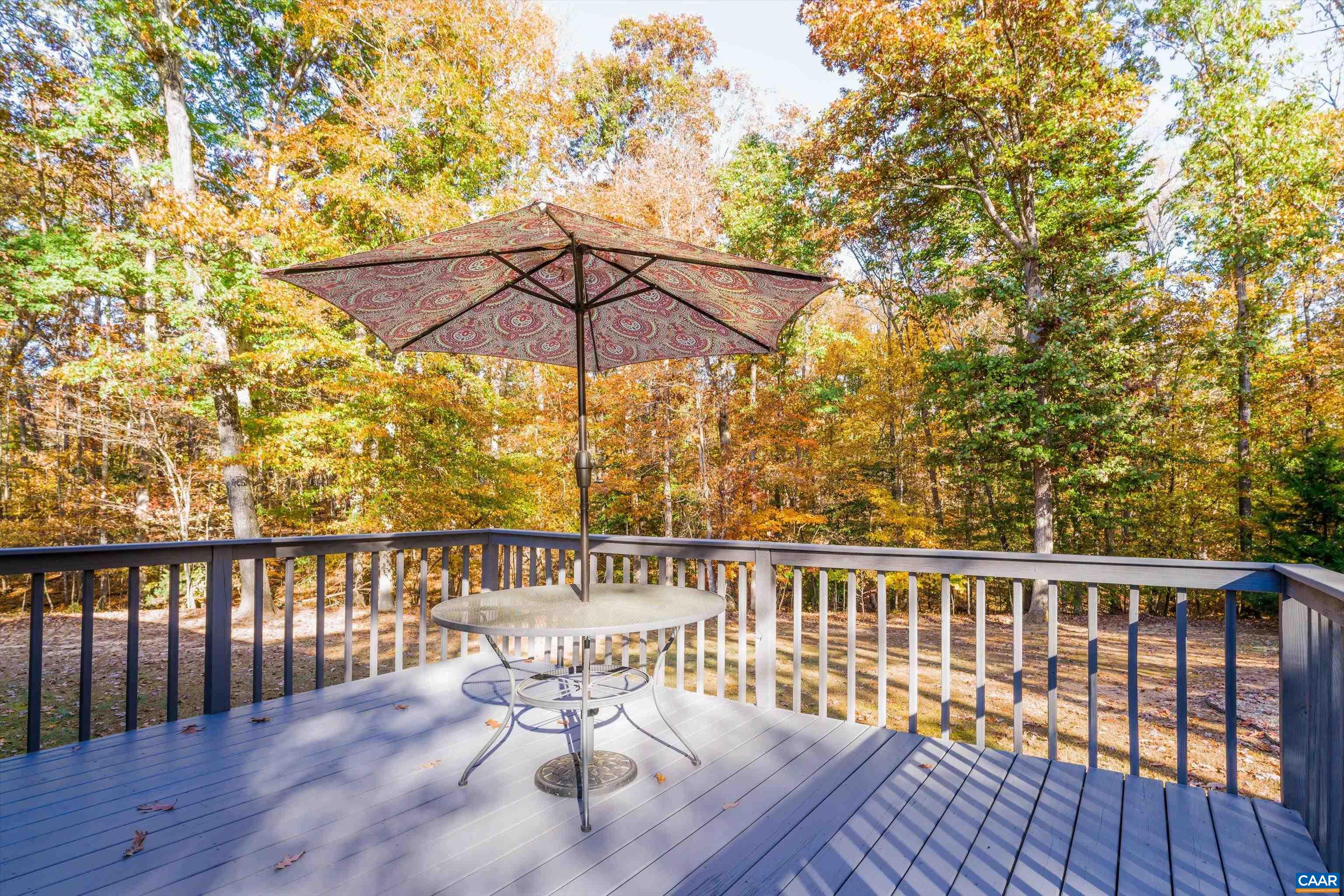 2321 Ruritan Lake Road Scottsville, VA 24590 - Photo 18 of 35 a view of a chair and table on the wooden floor