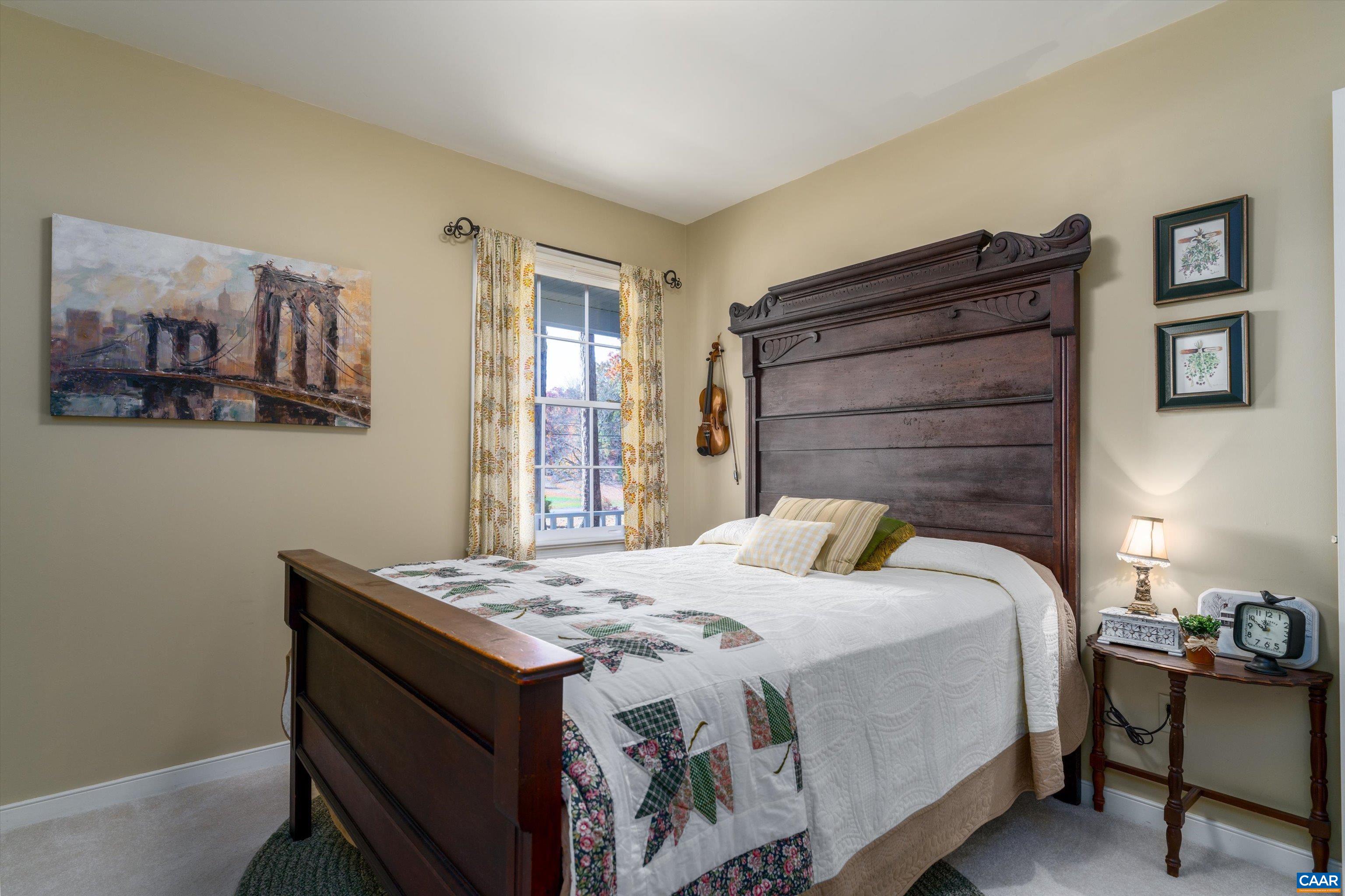 2321 Ruritan Lake Road Scottsville, VA 24590 - Photo 19 of 35 a bedroom with a bed and a dresser in it