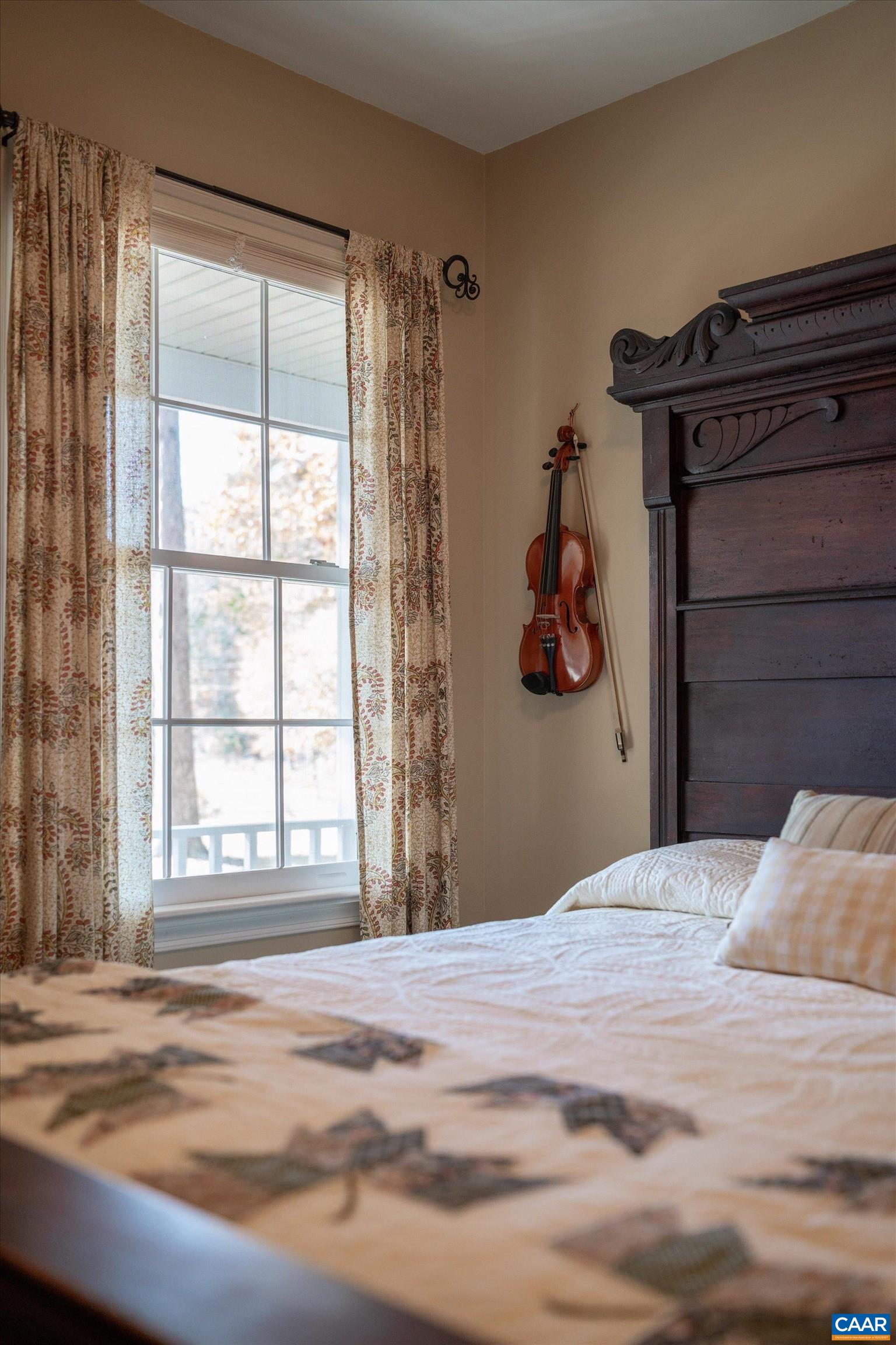 2321 Ruritan Lake Road Scottsville, VA 24590 - Photo 20 of 35 a bedroom with a bed and a window