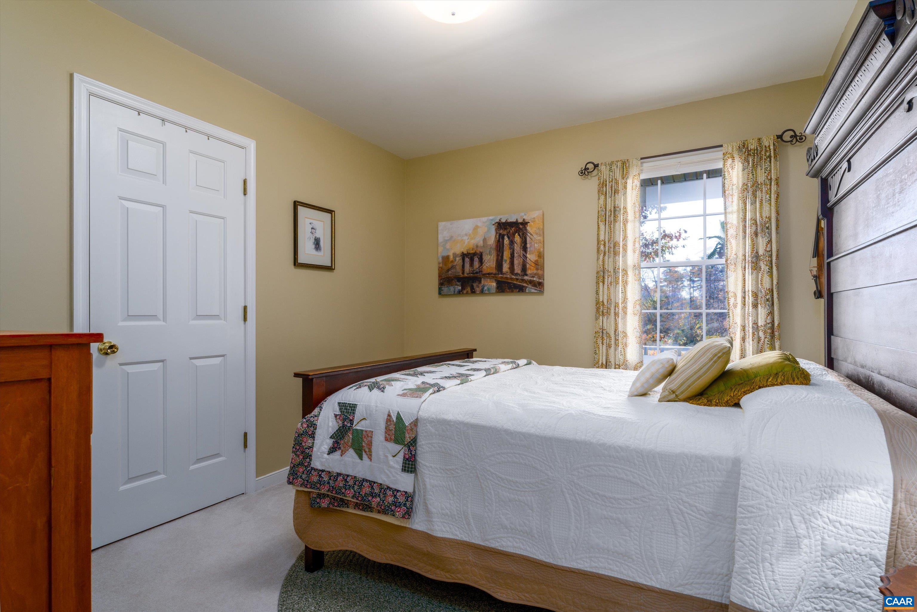 2321 Ruritan Lake Road Scottsville, VA 24590 - Photo 21 of 35 a bedroom with a bed and window